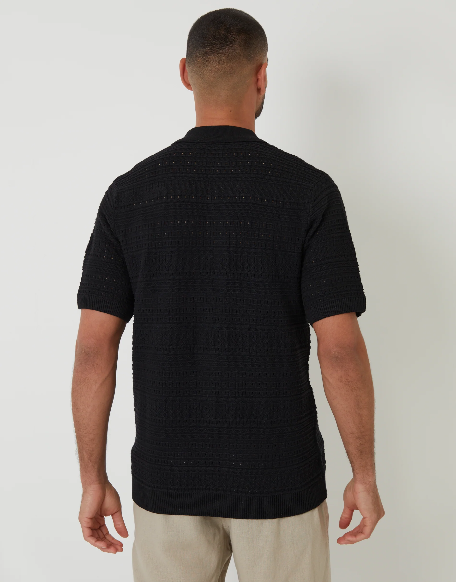 Textured Knitted Button Through Polo Shirt in Black - Image 2
